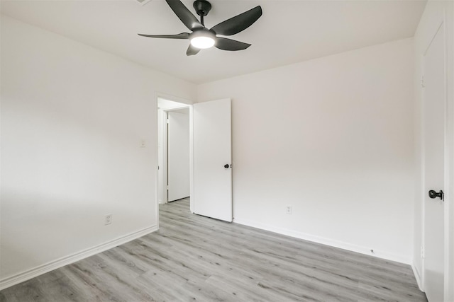 spare room featuring ceiling fan and light hardwood / wood-style floors