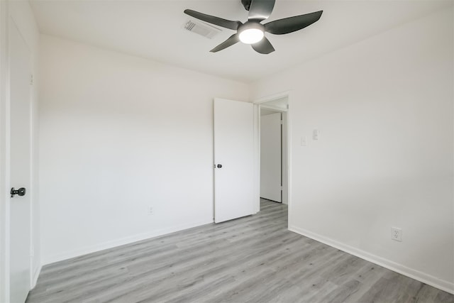 spare room with ceiling fan and light hardwood / wood-style flooring