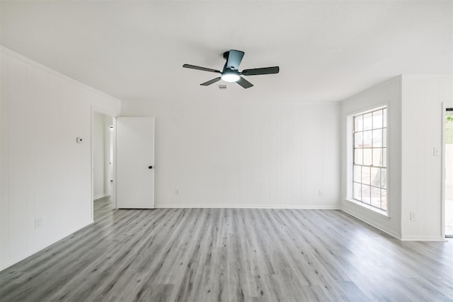 spare room with light hardwood / wood-style floors and ceiling fan