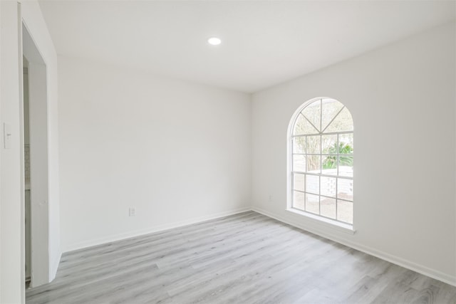 spare room with light hardwood / wood-style floors