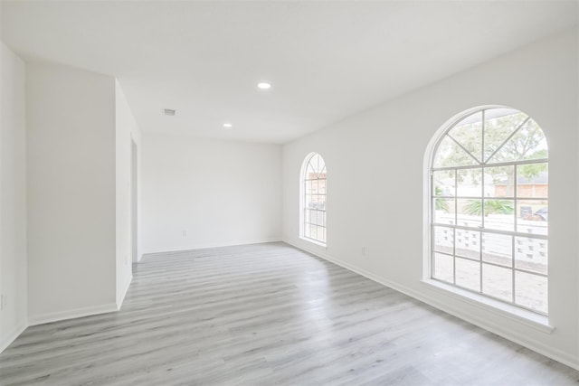 spare room featuring light wood-type flooring