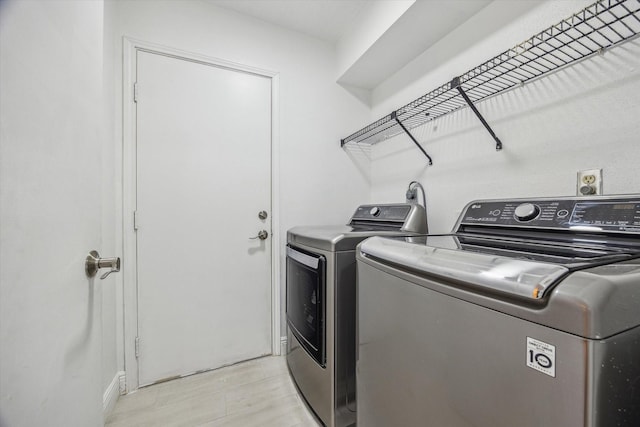 laundry room with washer and dryer