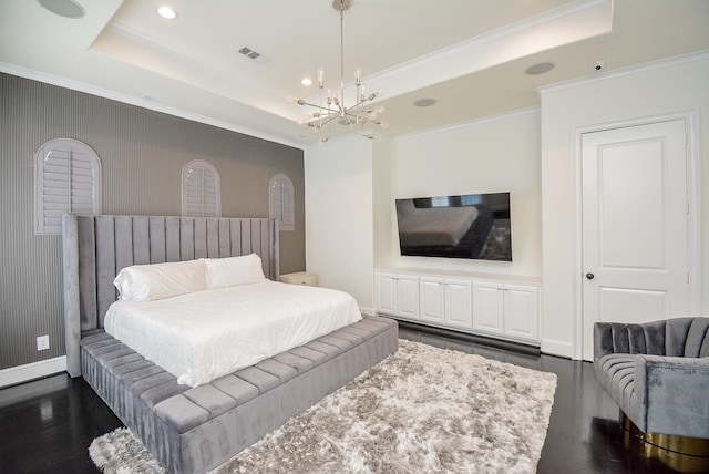 bedroom featuring dark hardwood / wood-style flooring, crown molding, a raised ceiling, and a chandelier