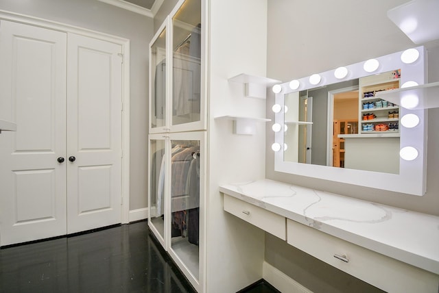 bathroom featuring crown molding and vanity