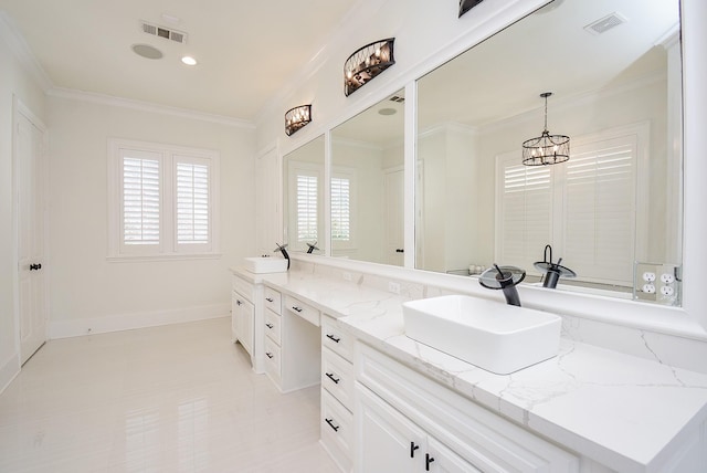 bathroom with an inviting chandelier, vanity, and crown molding