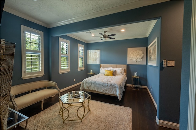 bedroom with ceiling fan, dark wood-type flooring, a textured ceiling, and ornamental molding