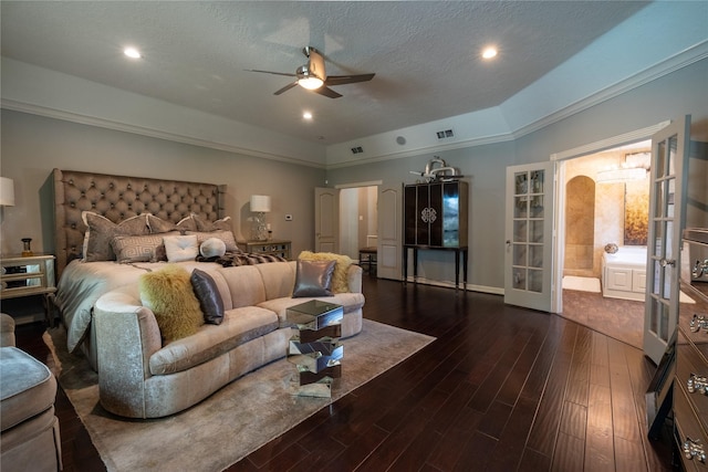 bedroom featuring dark wood-type flooring, french doors, a raised ceiling, ceiling fan, and a textured ceiling