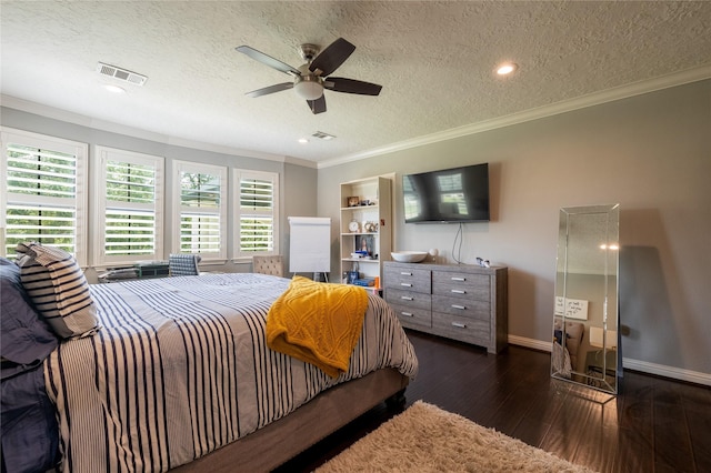 bedroom with ceiling fan, dark hardwood / wood-style floors, ornamental molding, and a textured ceiling