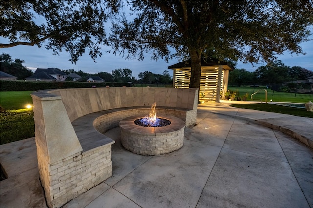 patio terrace at dusk with a fire pit