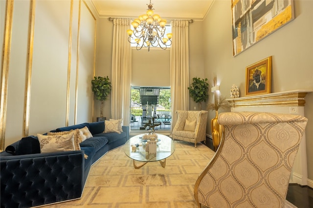 sitting room with ornamental molding and an inviting chandelier