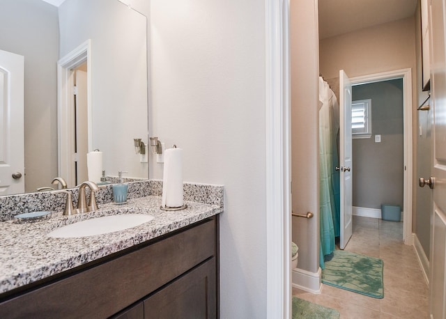 bathroom with tile patterned floors and vanity