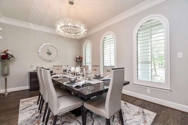 dining area with dark hardwood / wood-style flooring, ornamental molding, and an inviting chandelier