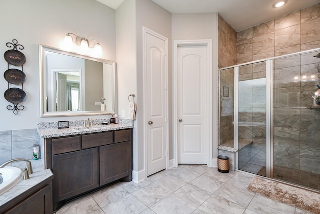 bathroom featuring vanity and plus walk in shower