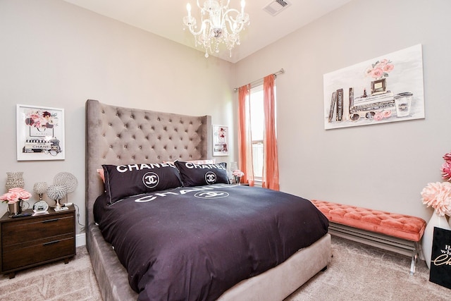 bedroom featuring a chandelier and light carpet