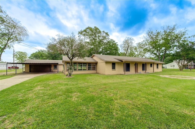 ranch-style home featuring a front yard and a carport