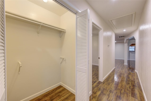 hall with dark wood-type flooring