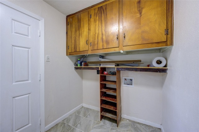 washroom featuring cabinets and hookup for a washing machine