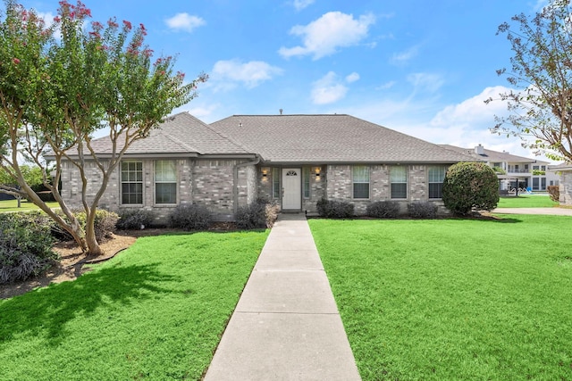 ranch-style home with a front lawn