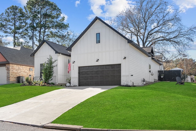 modern farmhouse style home with a front yard and a garage