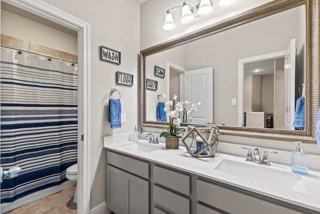 bathroom with a shower with curtain, vanity, and toilet