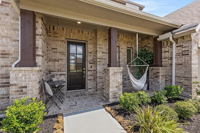 property entrance featuring covered porch