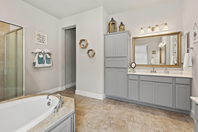 bathroom with vanity and separate shower and tub