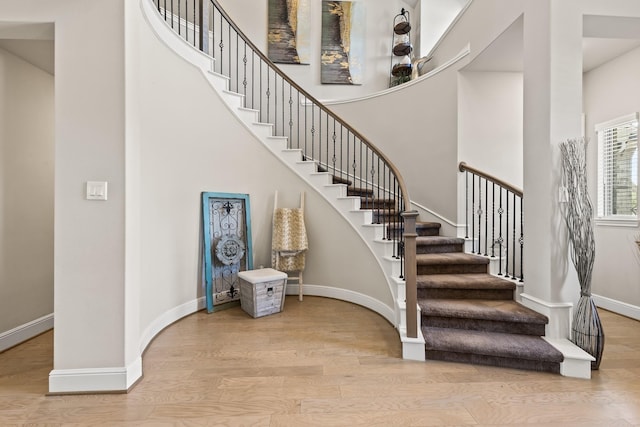 stairs with hardwood / wood-style floors