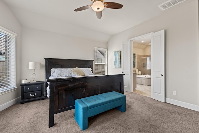 carpeted bedroom featuring ensuite bath, ceiling fan, and lofted ceiling