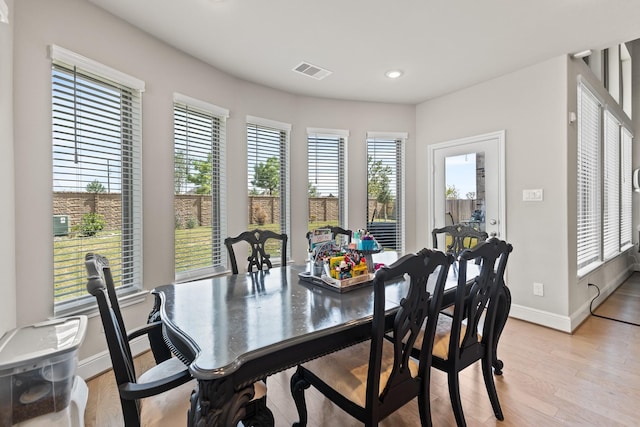 dining room featuring light hardwood / wood-style floors and a wealth of natural light