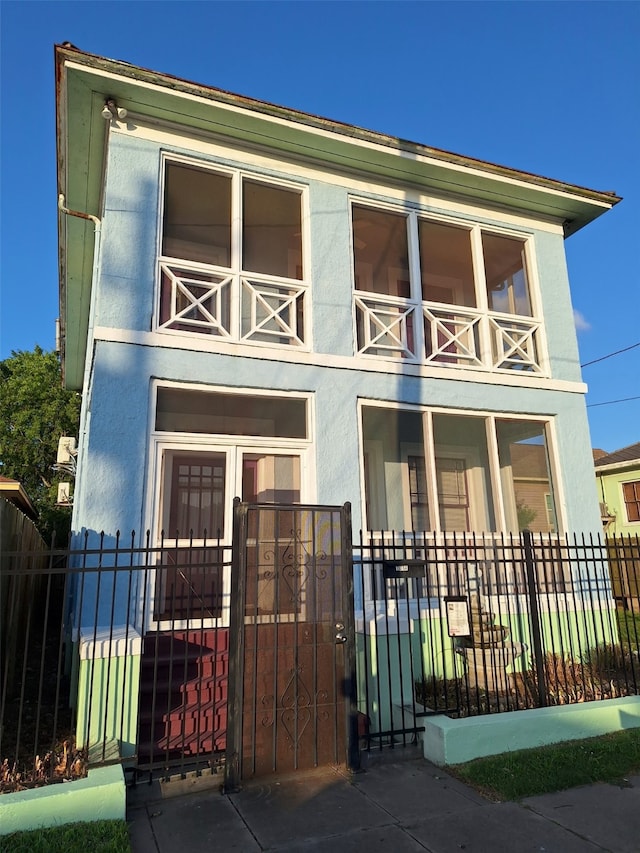 view of front of home with a balcony