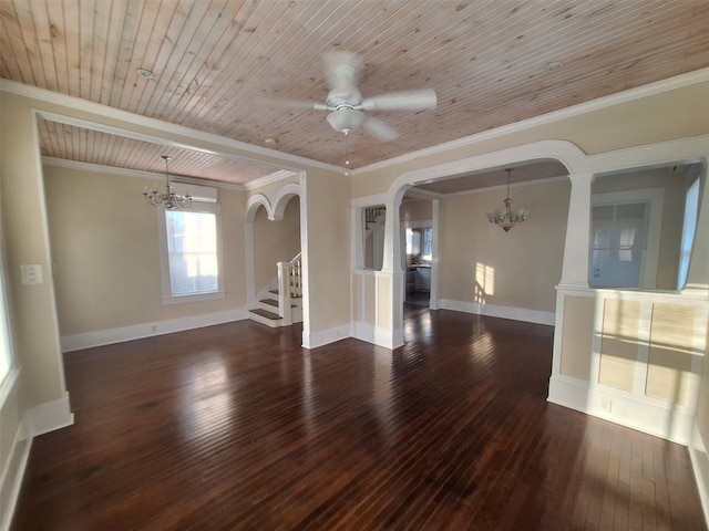 spare room with dark hardwood / wood-style flooring, ornate columns, wood ceiling, ceiling fan with notable chandelier, and crown molding