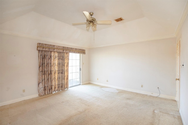 unfurnished room featuring light carpet, a tray ceiling, ceiling fan, and ornamental molding