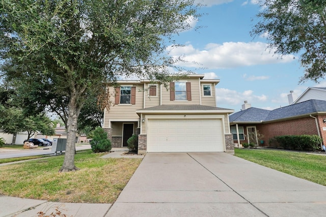 view of front facade featuring a front lawn and a garage