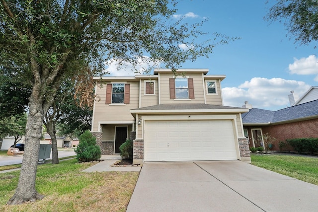 view of front of property featuring a garage and a front lawn