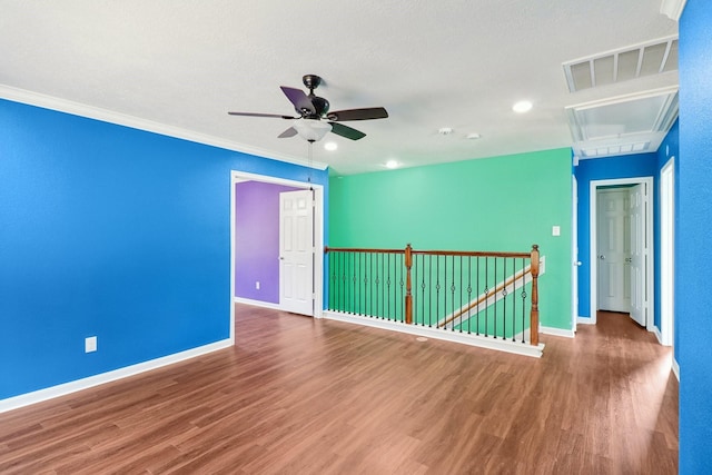 empty room with hardwood / wood-style floors, ceiling fan, and ornamental molding