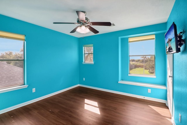 spare room featuring hardwood / wood-style flooring and ceiling fan