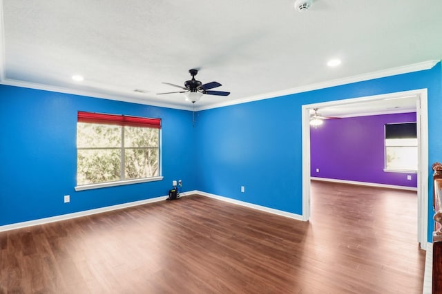 unfurnished room featuring crown molding, ceiling fan, and dark wood-type flooring