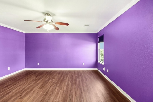 unfurnished room featuring hardwood / wood-style flooring, ceiling fan, and crown molding