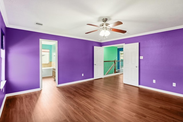 spare room featuring ceiling fan, hardwood / wood-style floors, and ornamental molding