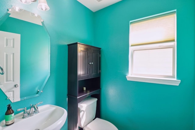 bathroom with toilet and sink