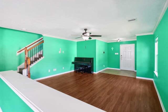 unfurnished living room featuring hardwood / wood-style floors, a textured ceiling, ceiling fan, and crown molding