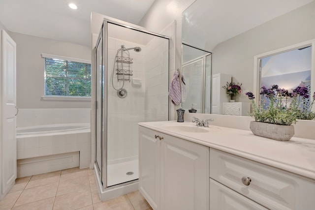 bathroom featuring tile patterned floors, vanity, and plus walk in shower