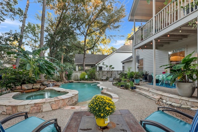 view of swimming pool with an in ground hot tub and a patio