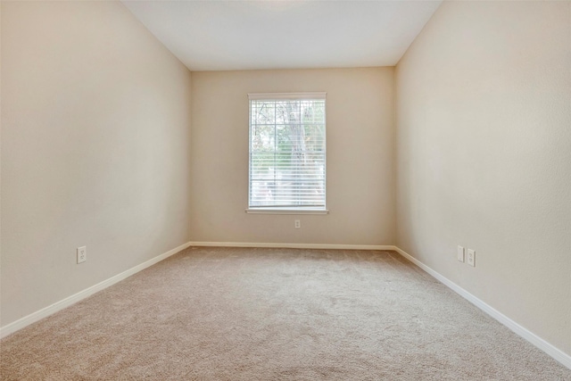 unfurnished room featuring carpet flooring