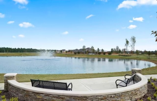 surrounding community with a water view