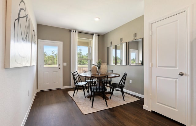 dining space featuring dark hardwood / wood-style floors