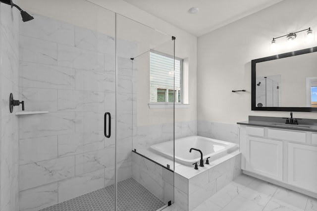 bathroom featuring separate shower and tub and vanity