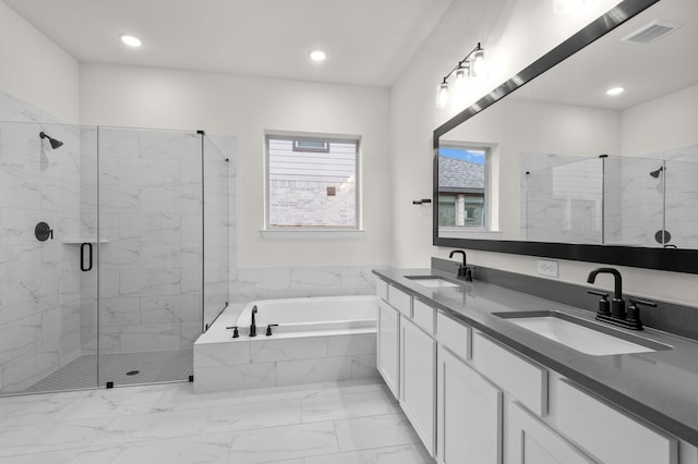 bathroom featuring vanity and separate shower and tub