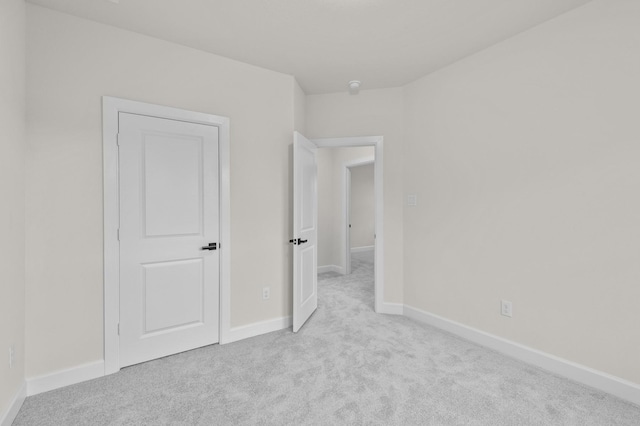 unfurnished bedroom with light carpet