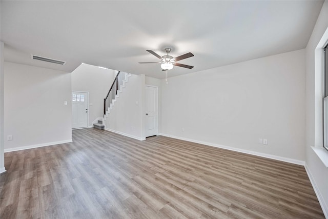 unfurnished living room with ceiling fan and light hardwood / wood-style flooring